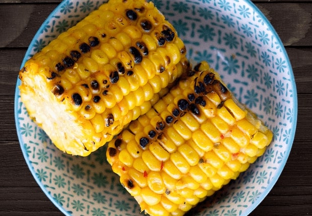 Grilled corn on the cob served in a patterned bowl at La Peri Peri in Sterling Heights, Michigan