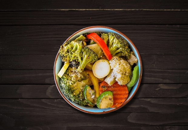 Bowl of grilled vegetables including broccoli, peppers, and zucchini served at La Peri Peri in Sterling Heights, MI