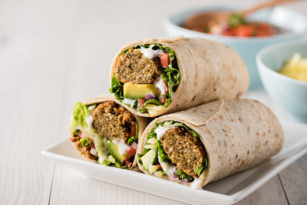 Vegetarian falafel wrap with lettuce, tomato, cucumber, garlic sauce, and mayo served at La Peri Peri in Sterling Heights, MI