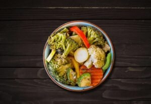 Bowl of grilled vegetables including broccoli, peppers, and zucchini served at La Peri Peri in Sterling Heights, MI