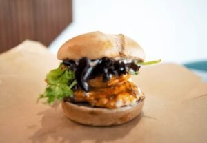 Zabiha Halal grilled peri chicken sandwich with coleslaw, cheese, and perinaise at La Peri Peri in Sterling Heights, MI